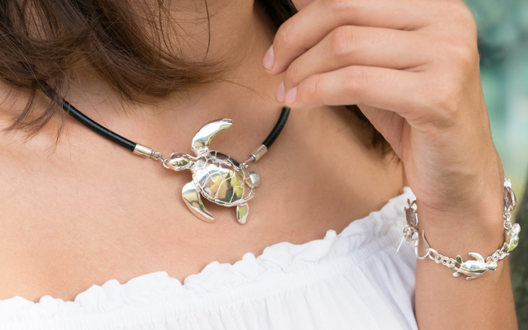 Lg honu necklace and sm honu link bracelet on model