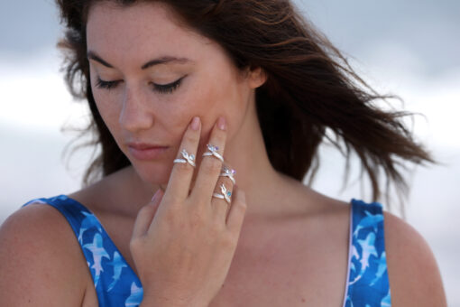 four mermaid rings on model